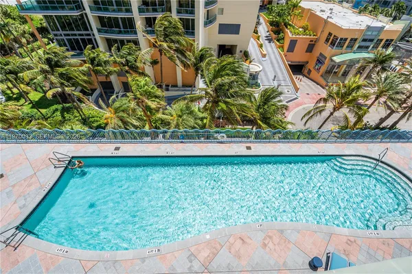 a view of a city that has tall trees