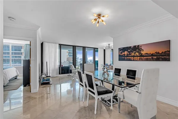 a view of a livingroom with furniture and a flat screen tv