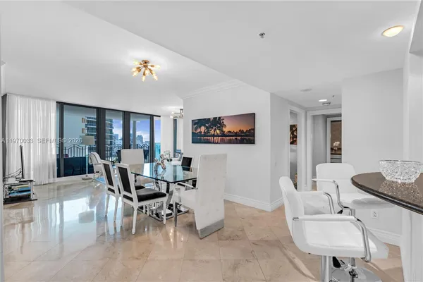 a dining room with furniture and window