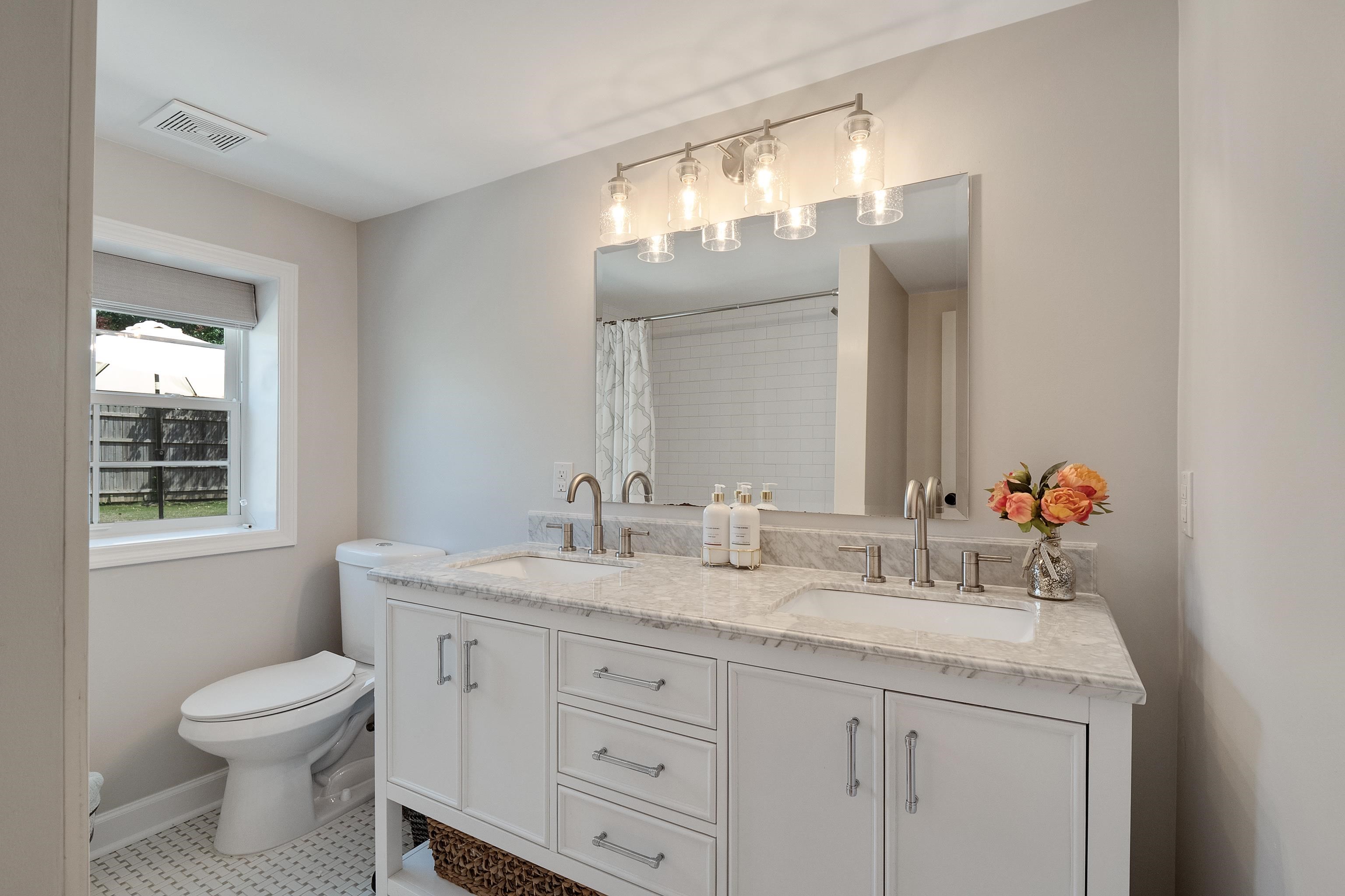 4800 Barfield Road Memphis, TN 38117 - Photo 18 of 25 a bathroom with a sink a toilet and a mirror