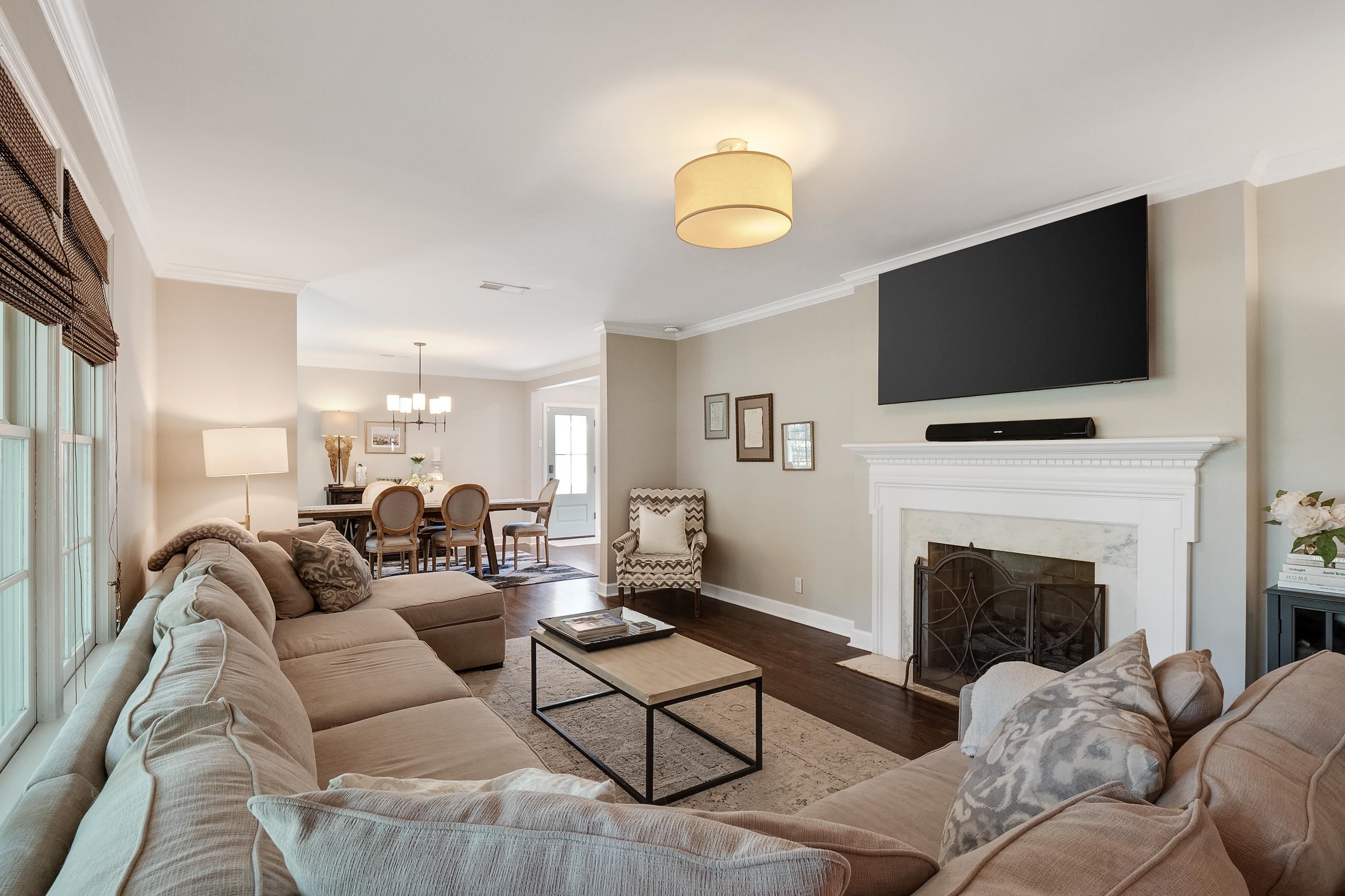 4800 Barfield Road Memphis, TN 38117 - Photo 3 of 25 a living room with fireplace furniture and a flat screen tv