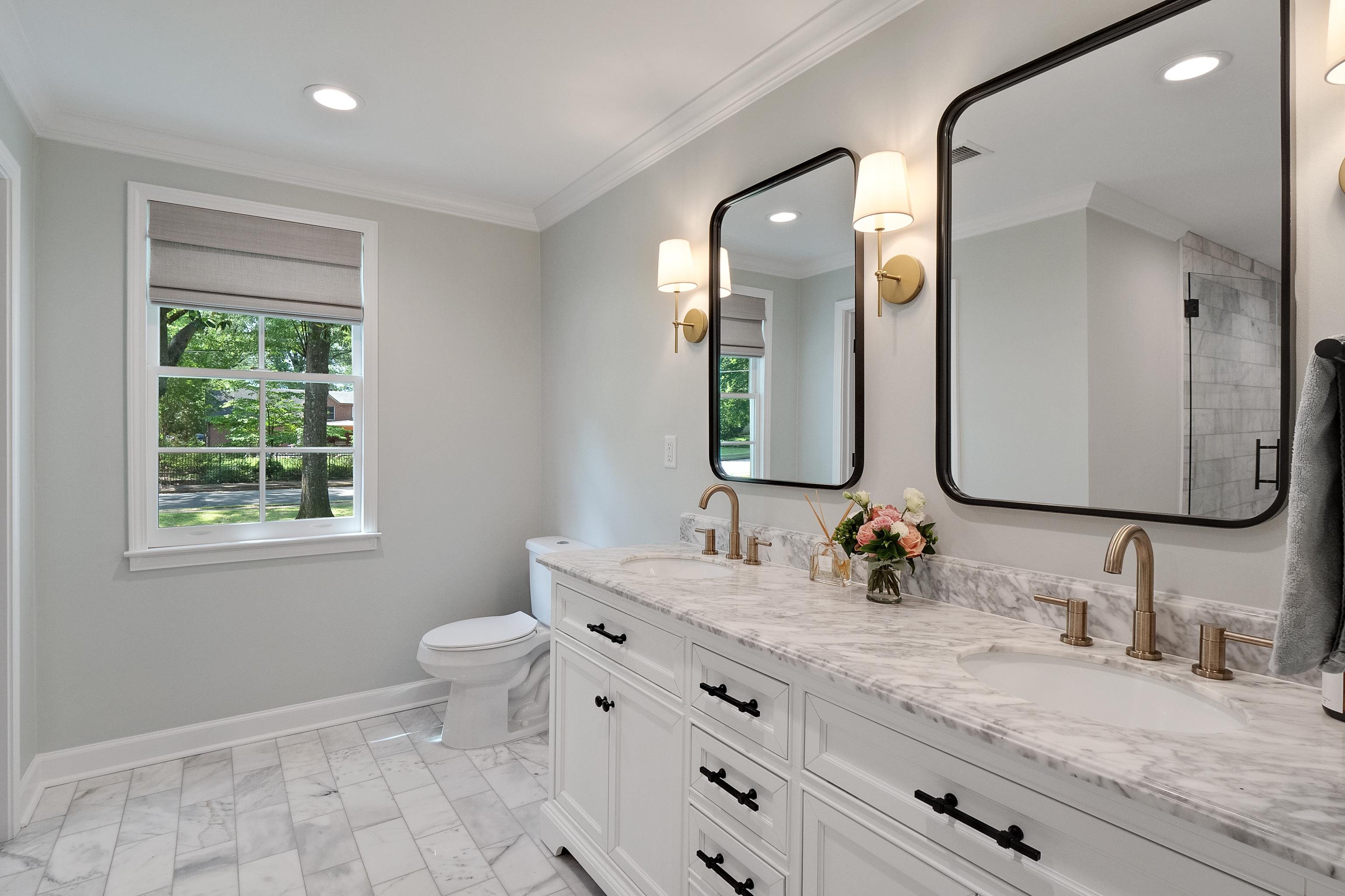 4800 Barfield Road Memphis, TN 38117 - Photo 10 of 25 a bathroom with a granite countertop toilet sink and mirror