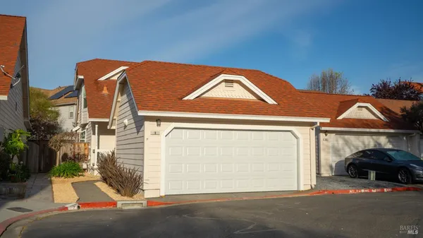 a front view of a house with parking