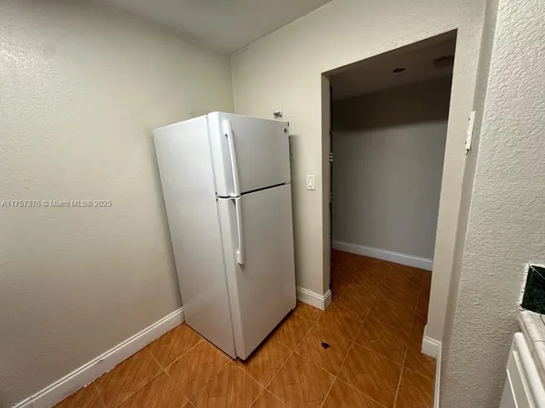 a kitchen with a sink a stove and cabinets
