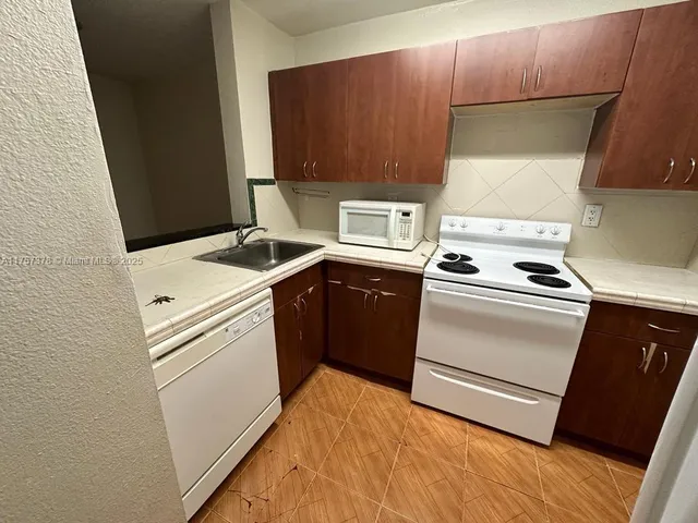 a utility room with washer and dryer