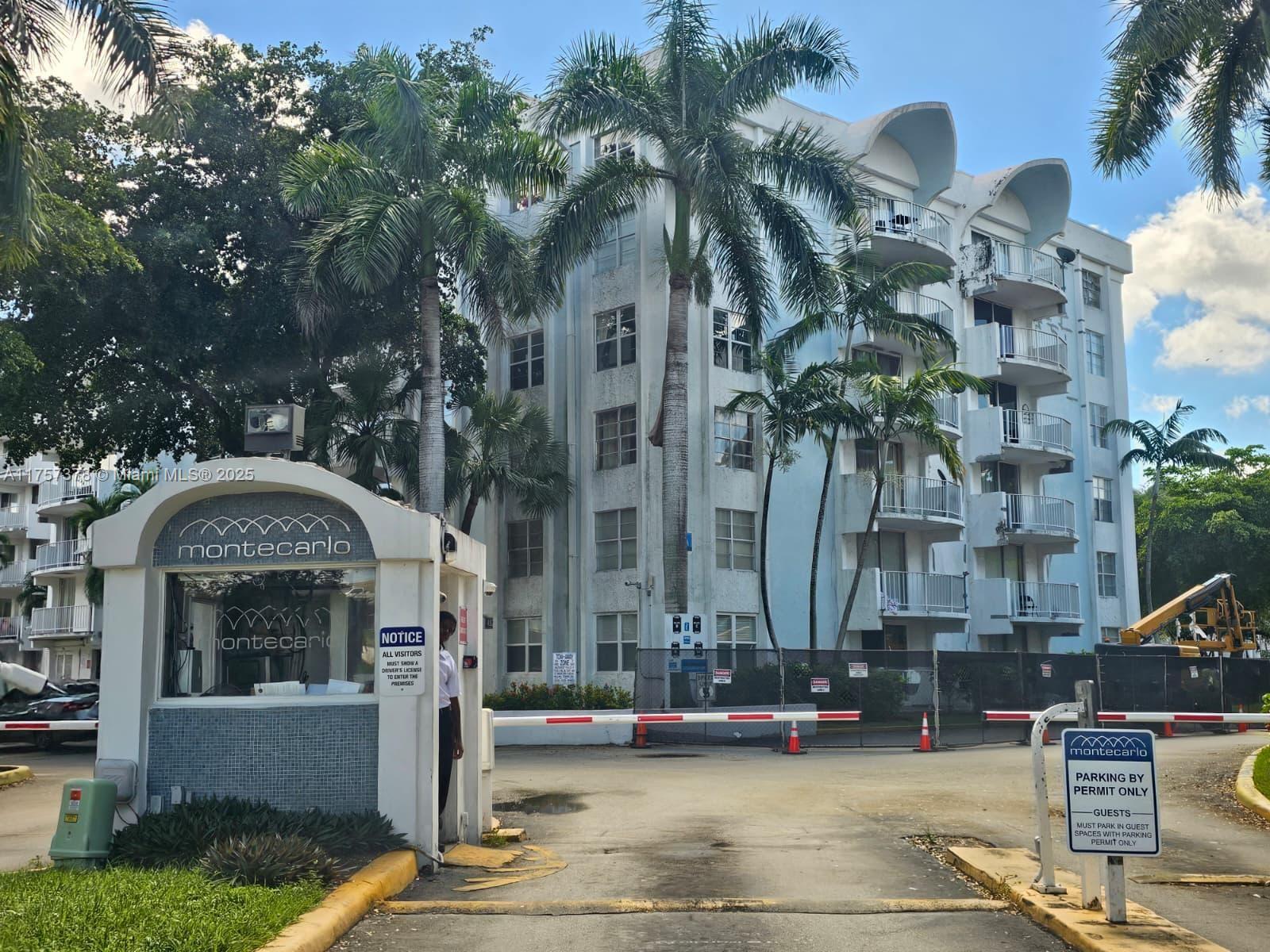 492 Northwest 165th Street, Unit C211 Miami, FL 33169 - Photo 2 of 26 a front view of a house with street