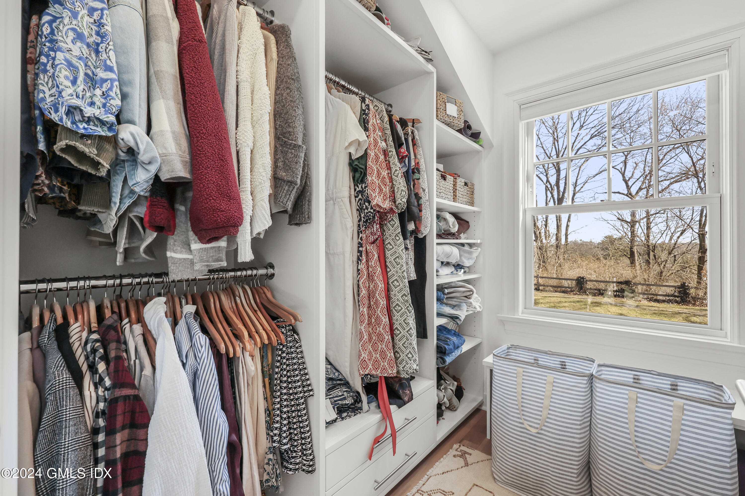 18 Annjim Drive Greenwich, CT 06830 - Photo 13 of 23 a view of walk in closet with clothes and shoes