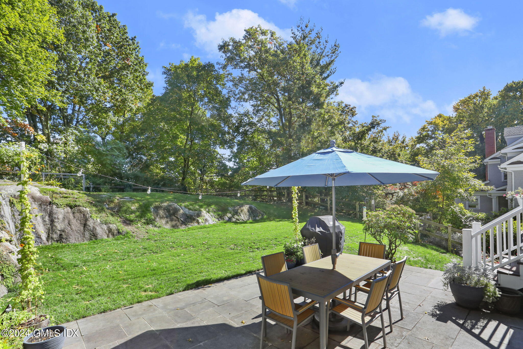 18 Annjim Drive Greenwich, CT 06830 - Photo 19 of 23 a view of a patio with furniture and a garden