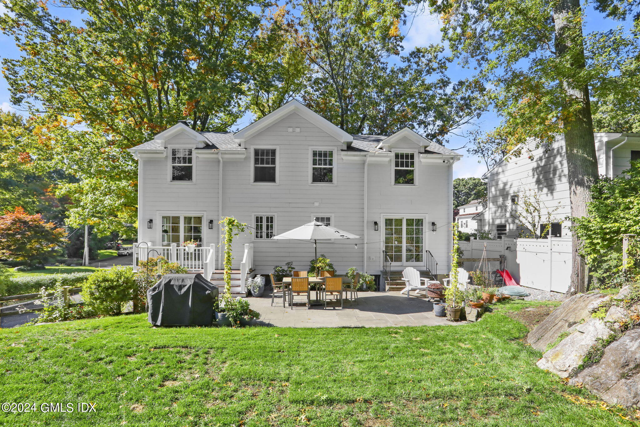 18 Annjim Drive Greenwich, CT 06830 - Photo 20 of 23 a front view of a house with garden