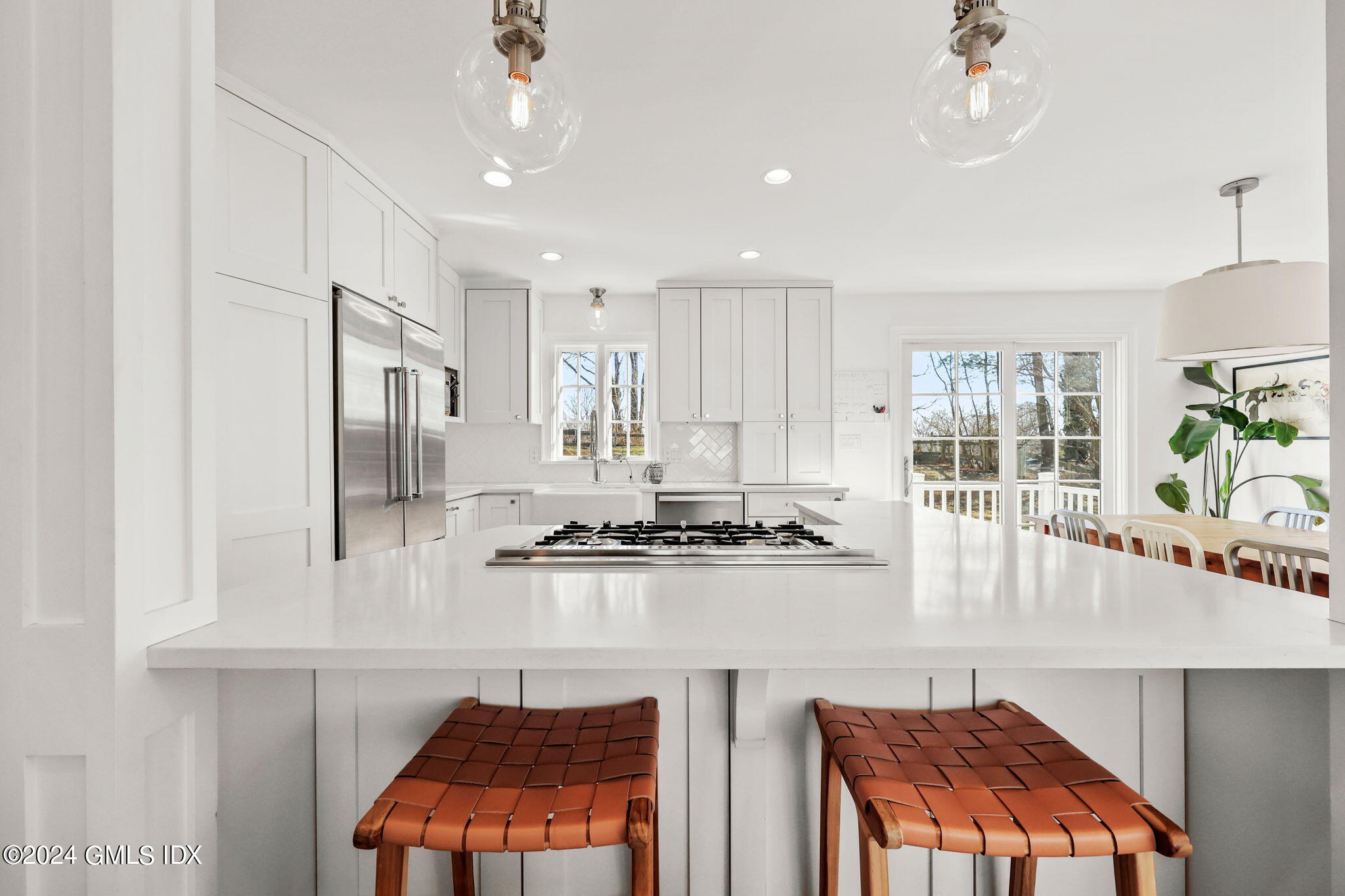 18 Annjim Drive Greenwich, CT 06830 - Photo 7 of 23 a kitchen with stainless steel appliances granite countertop a stove and a refrigerator