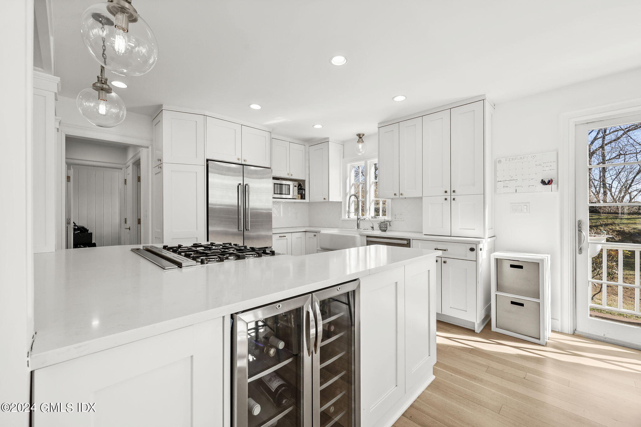 18 Annjim Drive Greenwich, CT 06830 - Photo 8 of 23 a kitchen with stainless steel appliances a sink stove and refrigerator