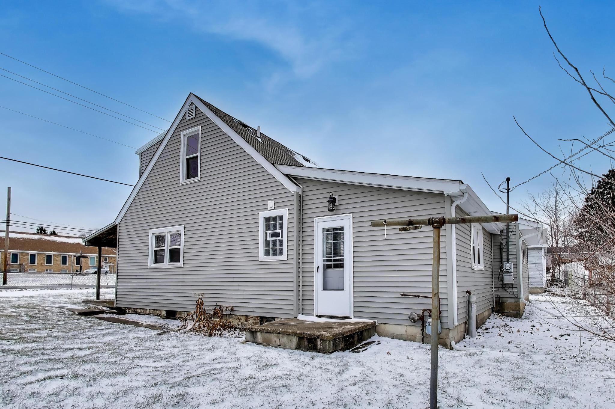 3561 Liverpool Road Lake Station, IN 46405 - Photo 14 of 16 a view of a house with a yard