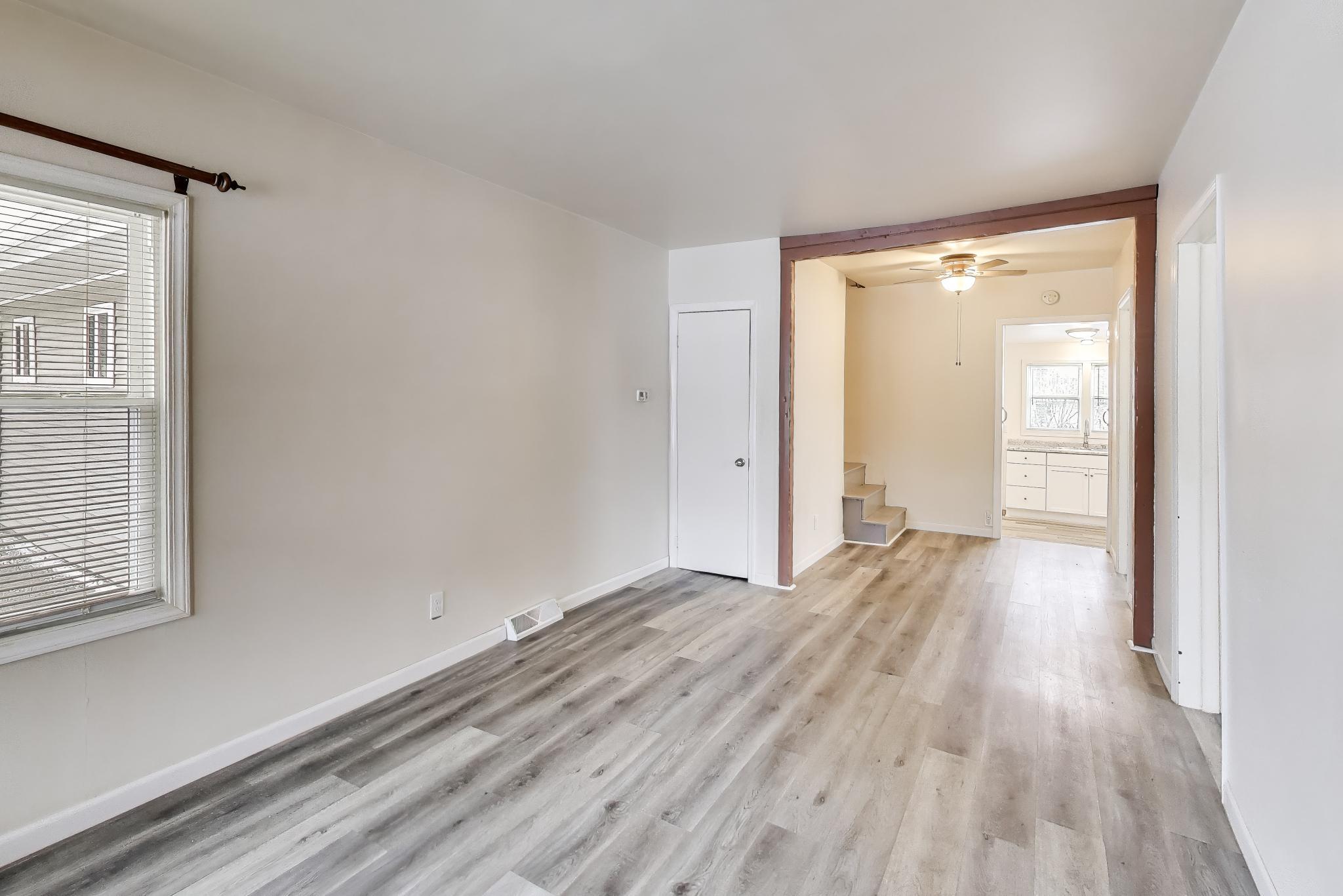 3561 Liverpool Road Lake Station, IN 46405 - Photo 2 of 16 a view of a room with wooden floor and window