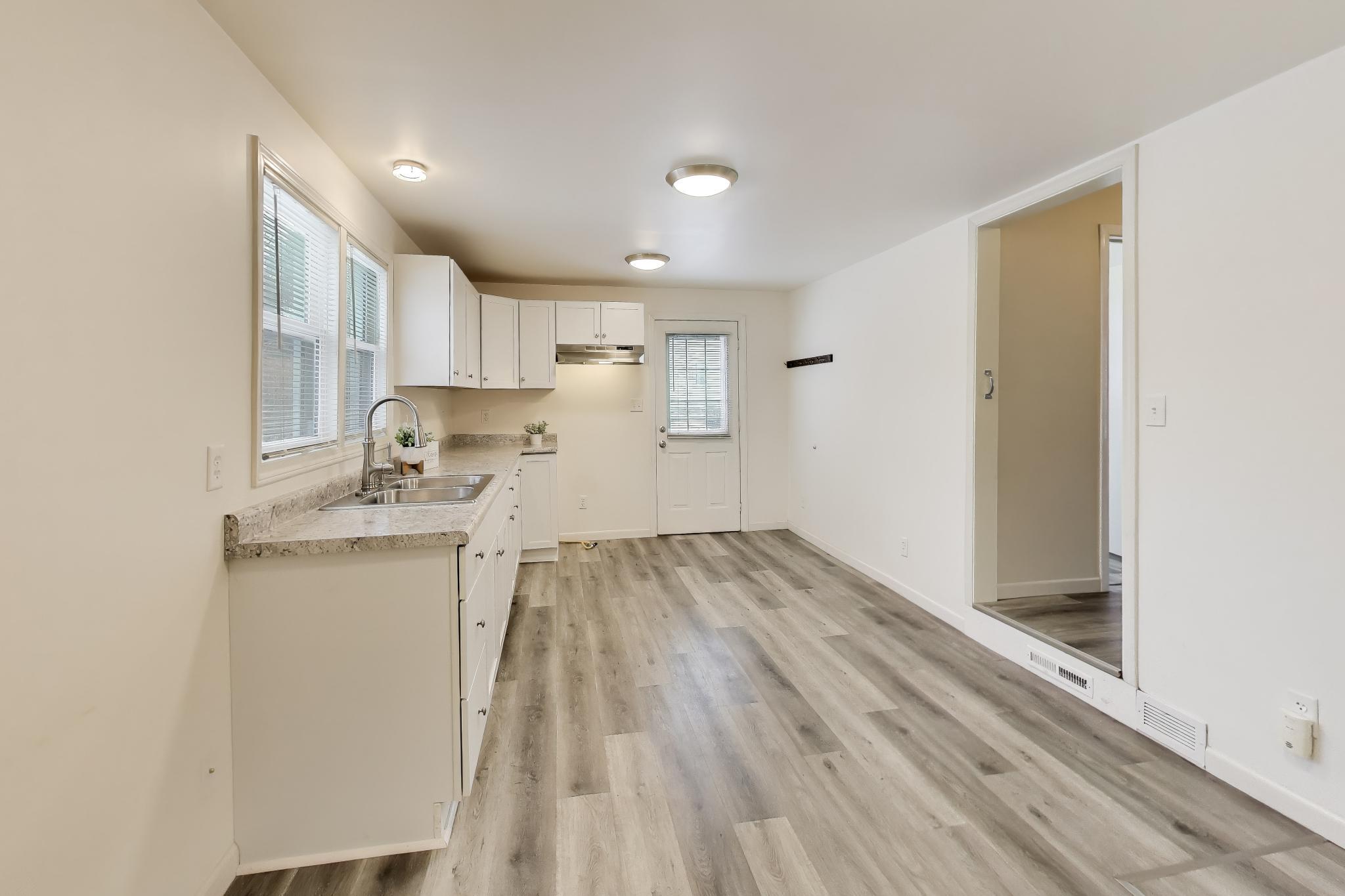 3561 Liverpool Road Lake Station, IN 46405 - Photo 5 of 16 a view of kitchen with wooden floor