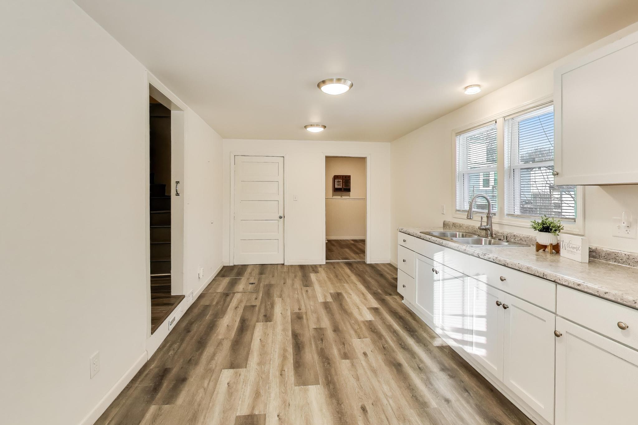 3561 Liverpool Road Lake Station, IN 46405 - Photo 6 of 16 a spacious bathroom with a sink and a mirror