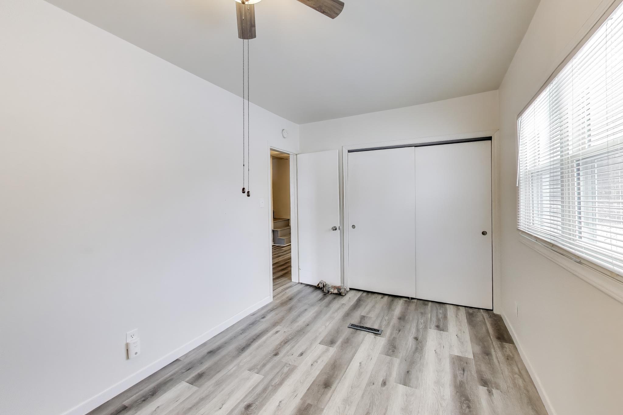3561 Liverpool Road Lake Station, IN 46405 - Photo 9 of 16 a view of a room with wooden floor and windows