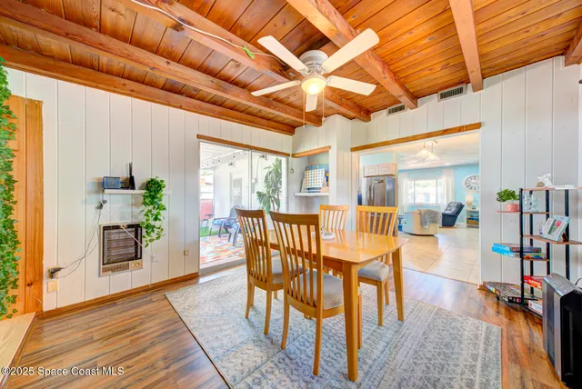 a view of balcony with wooden floor and outdoor seating