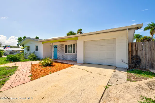 a house with garden in front of it