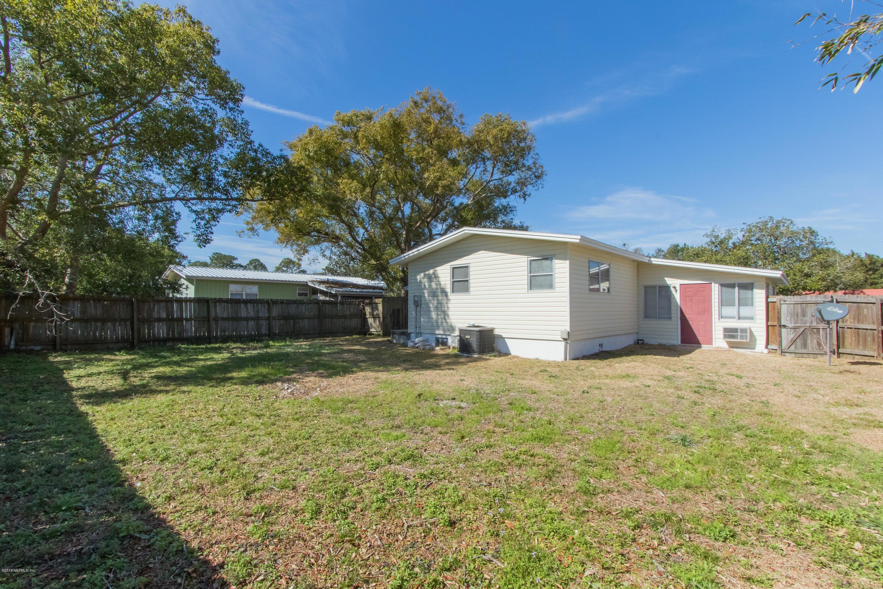 893 Palermo Road St. Augustine, FL 32086 - Photo 12 of 25 a view of a house with a yard and garage