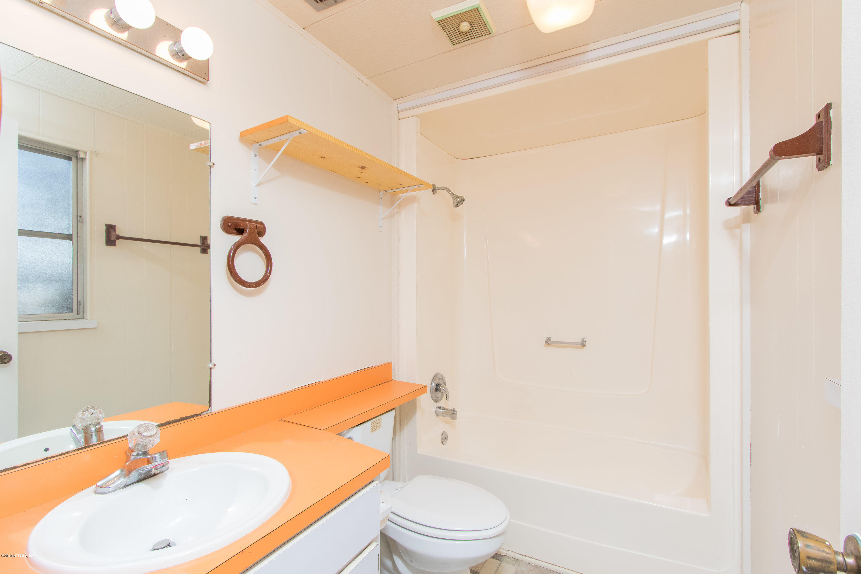 893 Palermo Road St. Augustine, FL 32086 - Photo 18 of 25 a bathroom with a sink toilet and shower