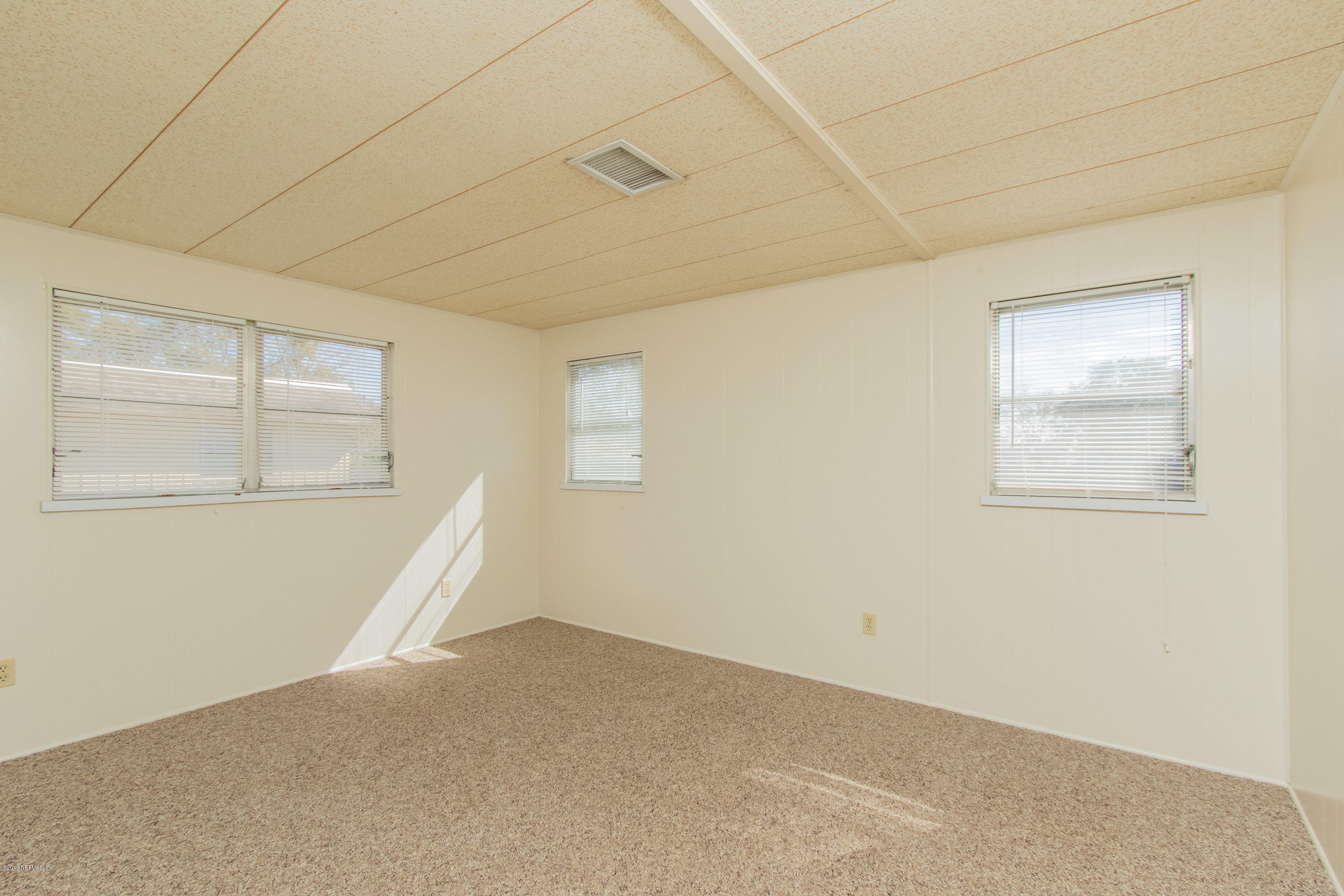 893 Palermo Road St. Augustine, FL 32086 - Photo 20 of 25 an empty room with windows