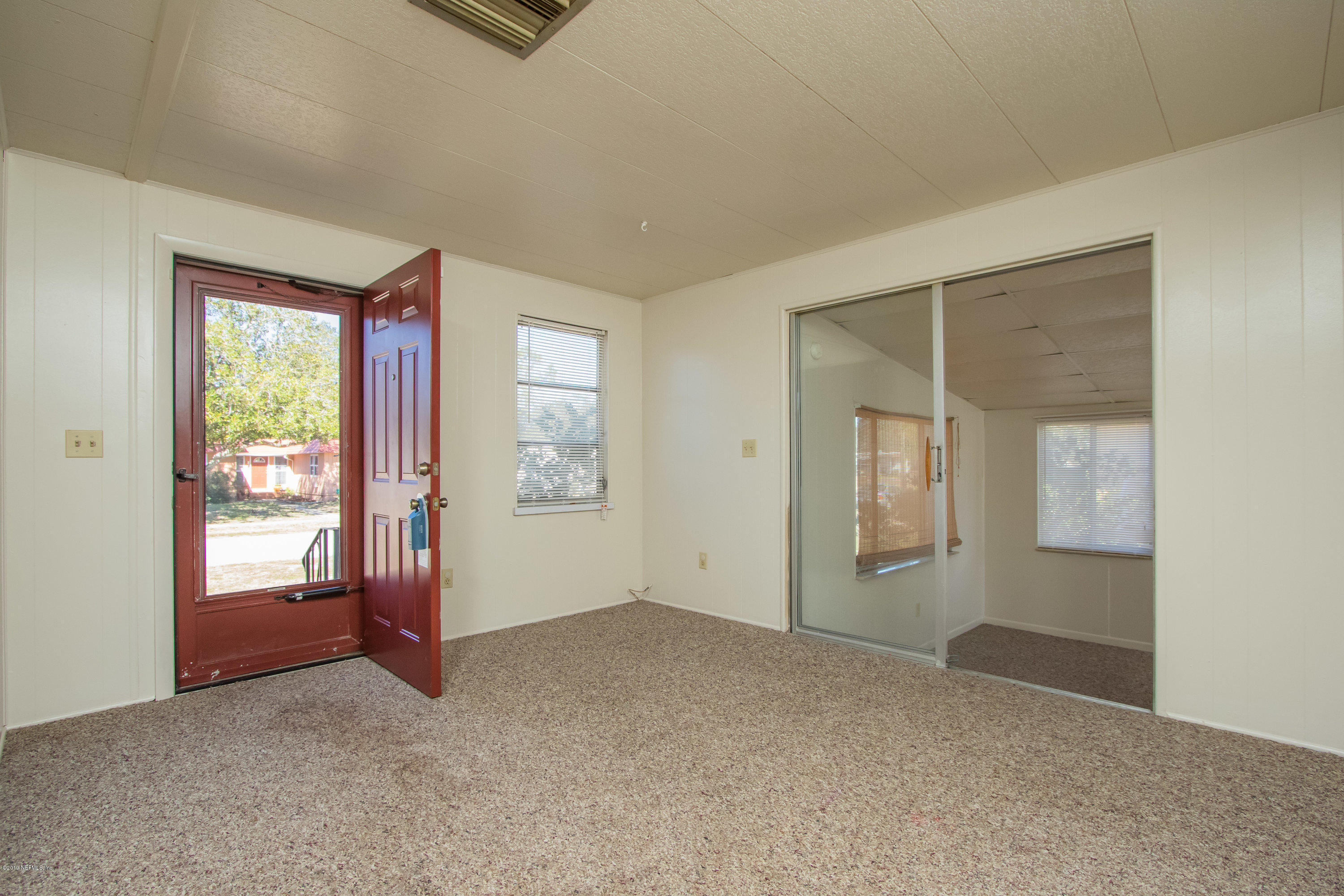 893 Palermo Road St. Augustine, FL 32086 - Photo 4 of 25 an empty room with windows