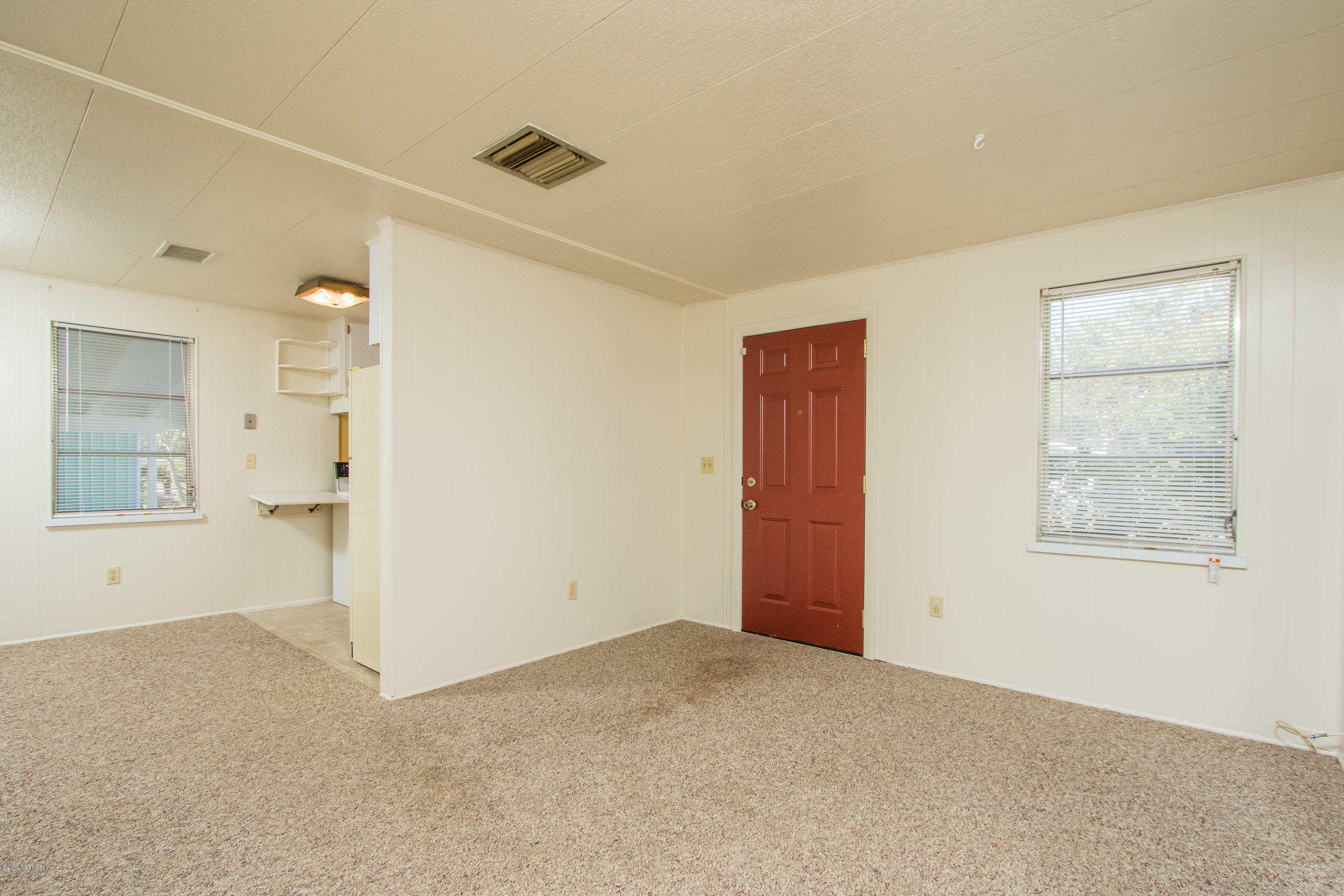 893 Palermo Road St. Augustine, FL 32086 - Photo 5 of 25 an empty room with windows and closet