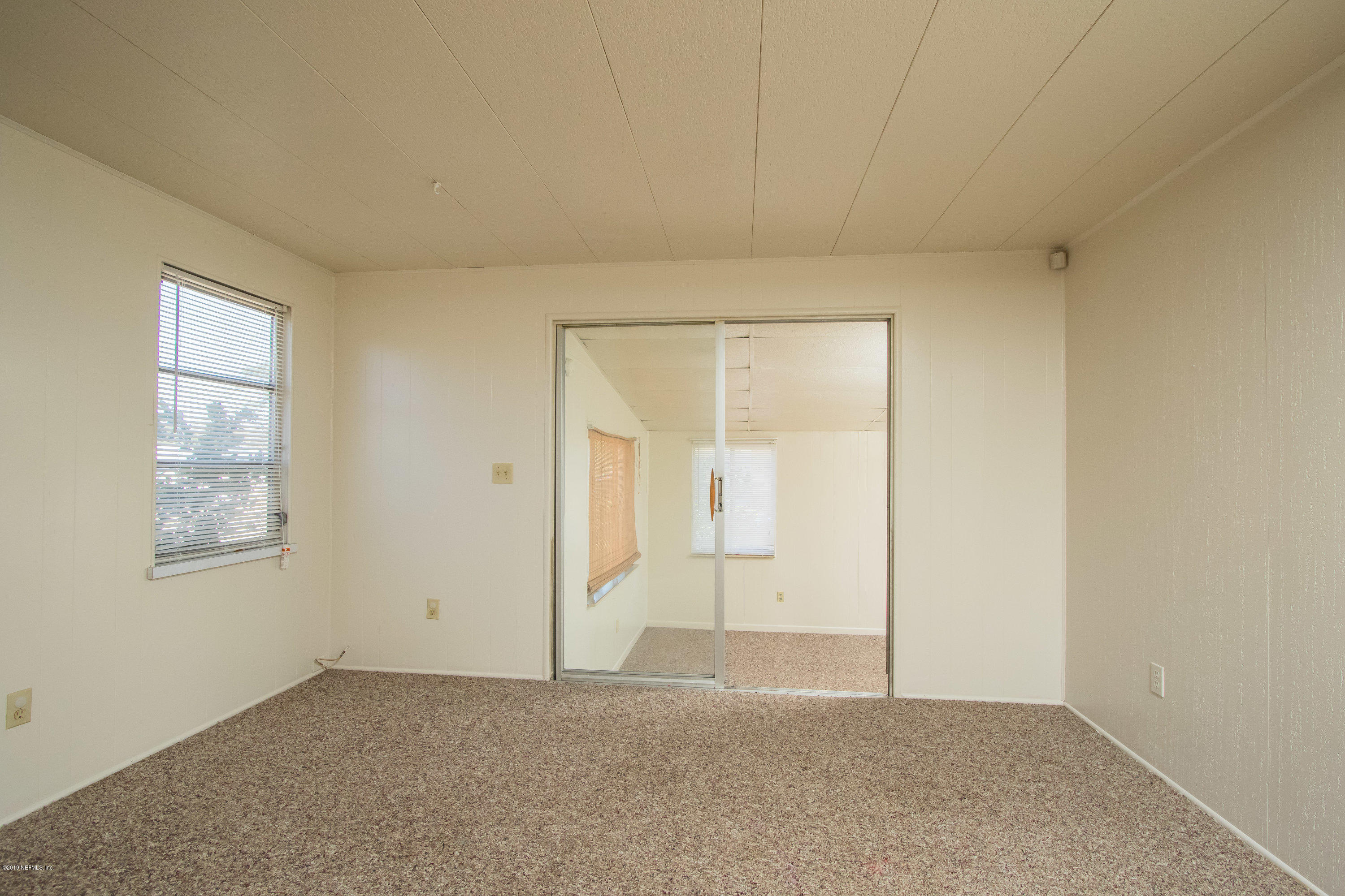 893 Palermo Road St. Augustine, FL 32086 - Photo 6 of 25 an empty room with windows and closet