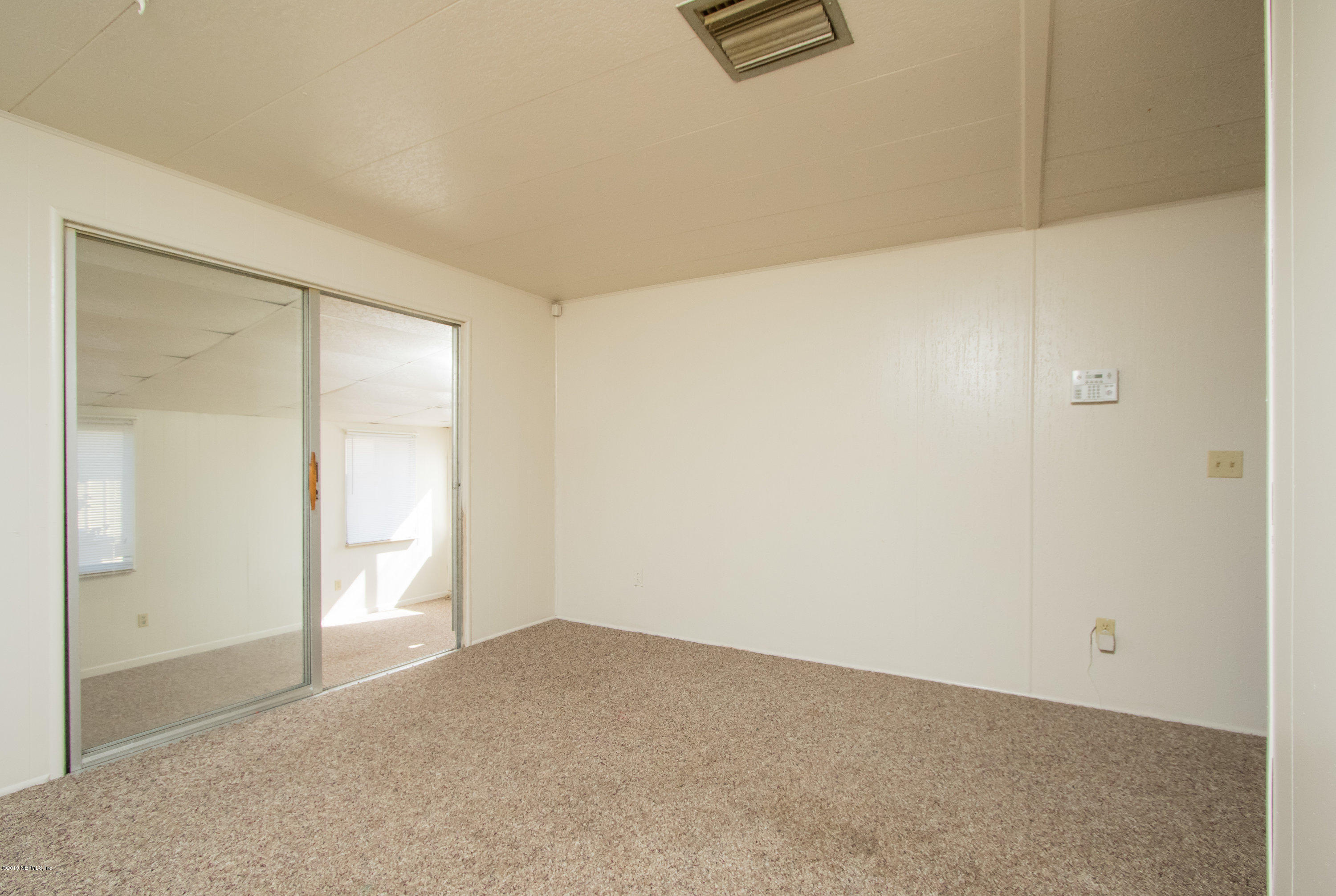 893 Palermo Road St. Augustine, FL 32086 - Photo 7 of 25 an empty room with windows