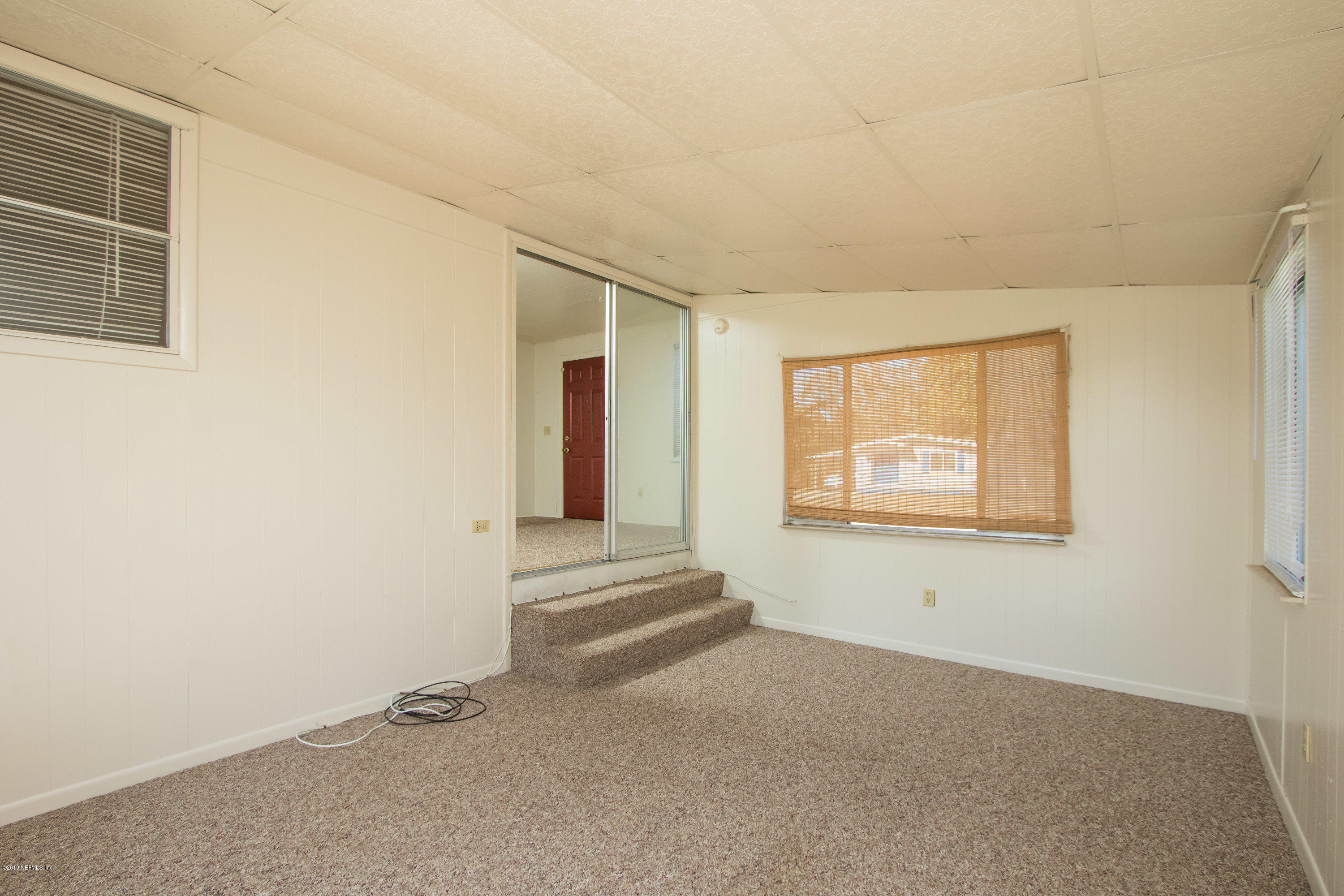 893 Palermo Road St. Augustine, FL 32086 - Photo 8 of 25 an empty room with windows