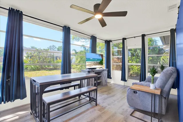 a room with furniture and a large window