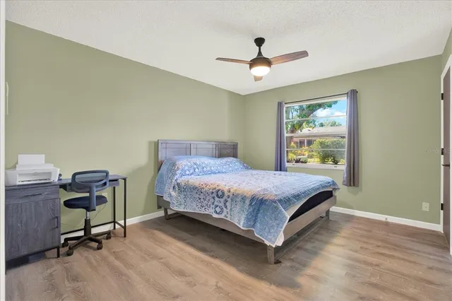 a living room with a bed furniture and a window