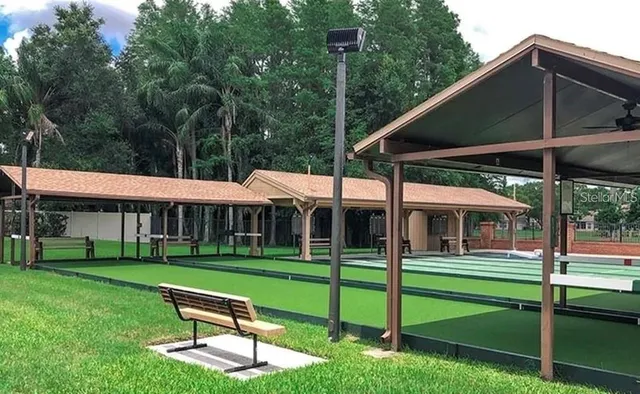 a house view with a sitting space and garden