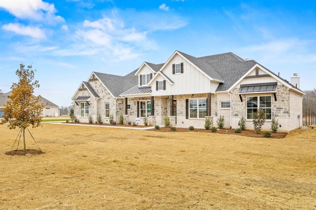 13835 Cashs Mill Road Sanger, TX 76266 - Photo 2 of 32 a front view of a house with a yard