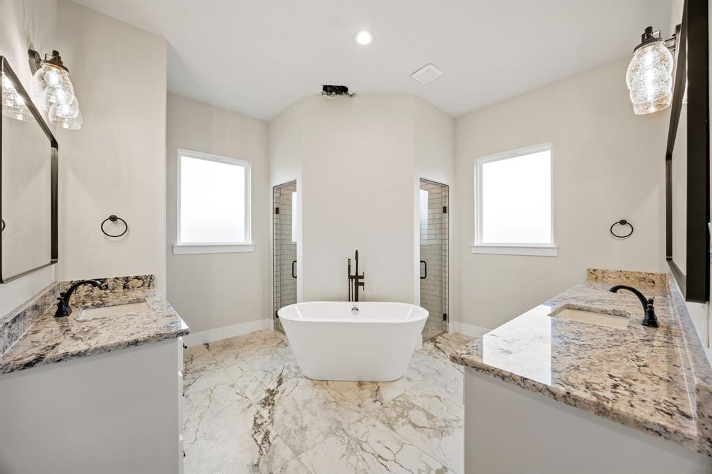 13835 Cashs Mill Road Sanger, TX 76266 - Photo 21 of 32 a bathroom with a granite countertop sink and a mirror