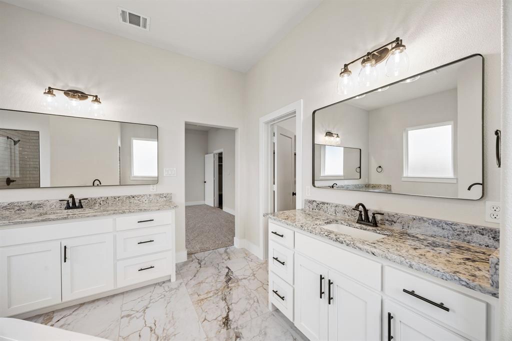 13835 Cashs Mill Road Sanger, TX 76266 - Photo 23 of 32 a bathroom with a granite countertop sink double and mirror