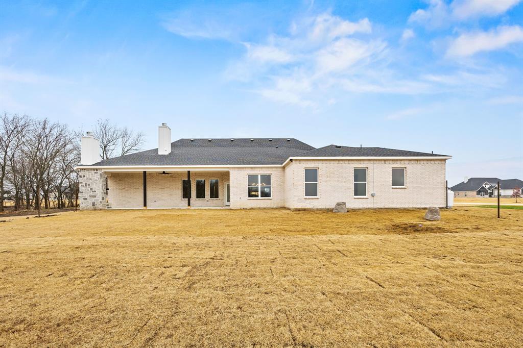 13835 Cashs Mill Road Sanger, TX 76266 - Photo 29 of 32 a front view of a house with a yard