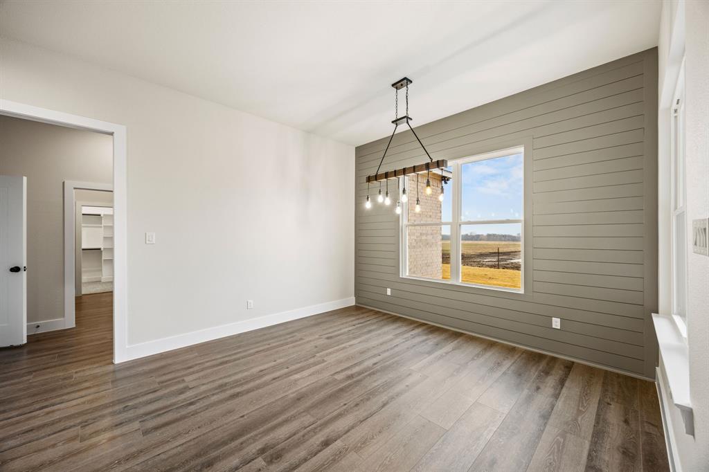 13835 Cashs Mill Road Sanger, TX 76266 - Photo 8 of 32 a view of empty room with wooden floor and fan