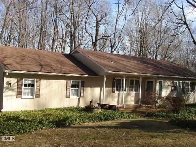 96 Wheeler Road Monroe, CT 06468 - Photo 1 of 1 a front view of a house with garden