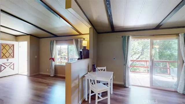 a view of room with wooden floor