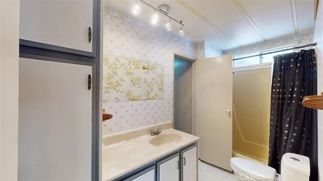 a kitchen with stainless steel appliances kitchen island granite countertop a stove and a refrigerator