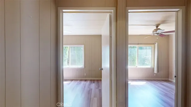 a bedroom with a bed and a mirror