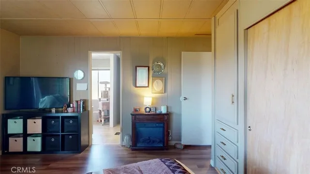 a spacious bedroom with a bed and windows