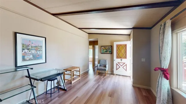 a view of a livingroom with furniture and wooden floor