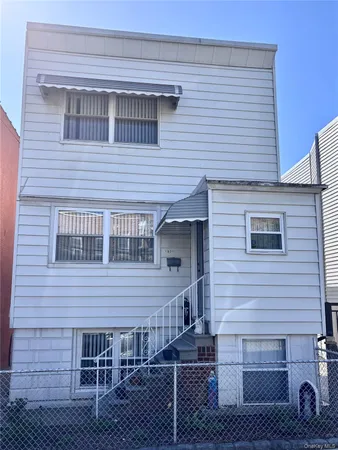 a front view of a house with a garage