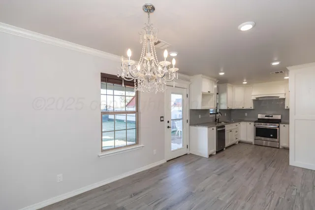 a view of a kitchen and chandelier