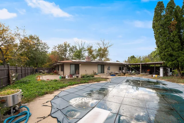 a view of an house with backyard space and garden