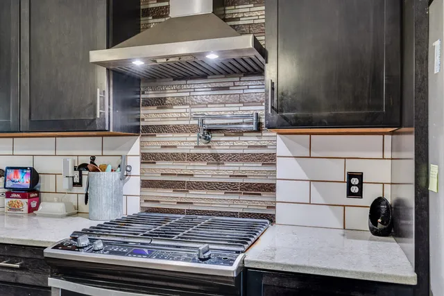 a kitchen with a stove and a cabinet