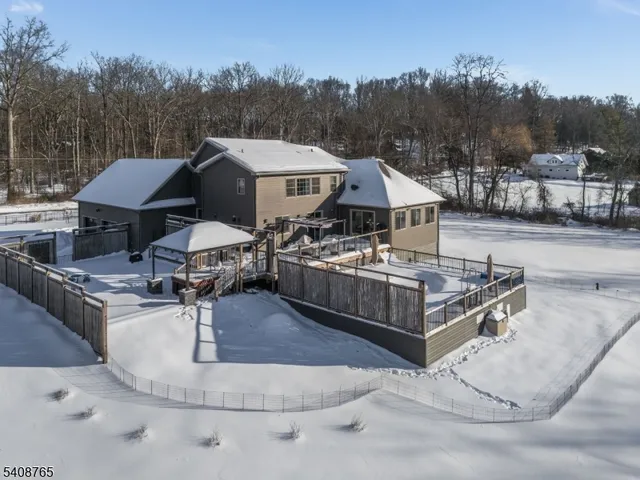 a view of a house with pool table and chairs