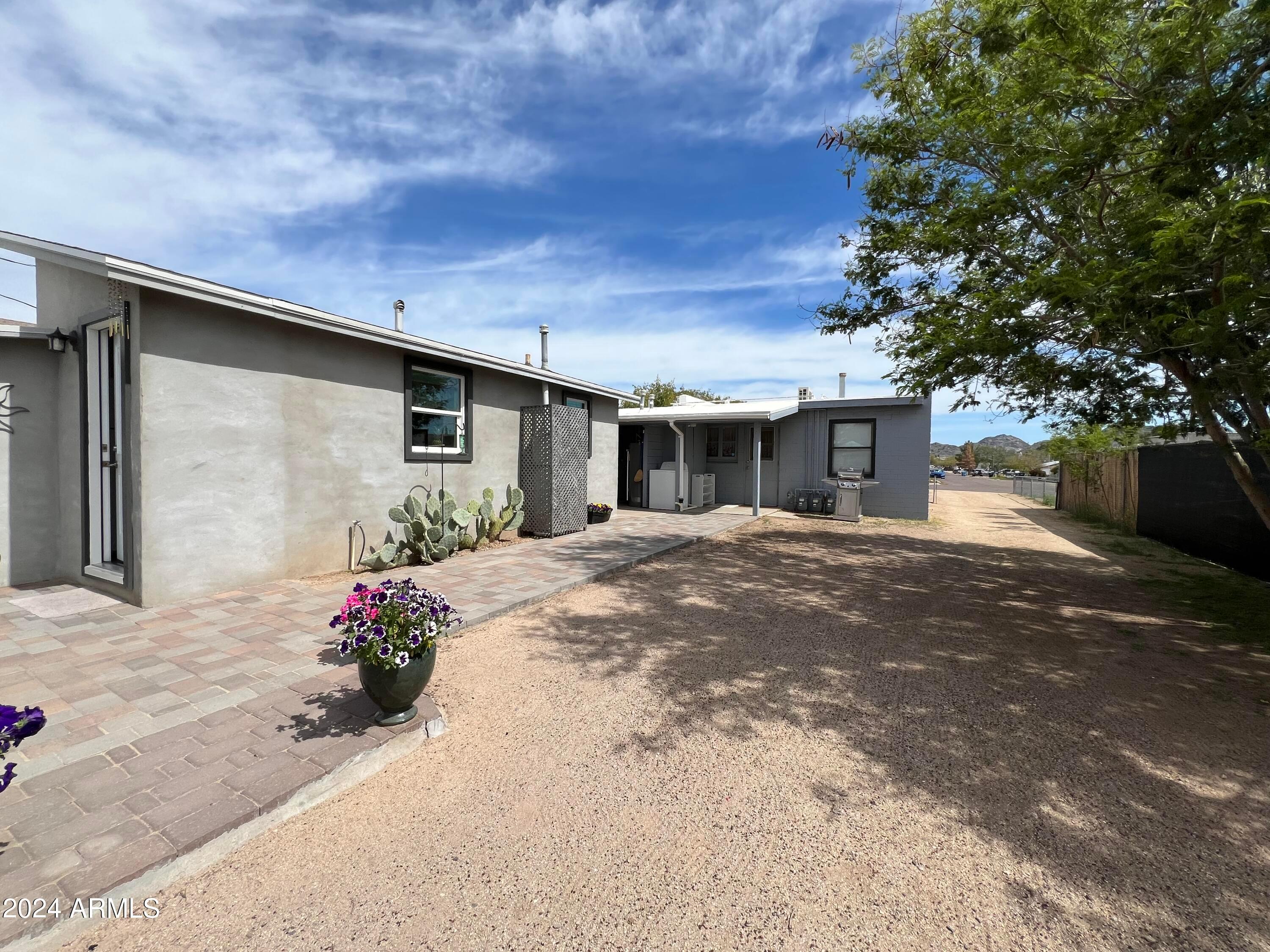 9502 North 2nd Place Phoenix, AZ 85020 - Photo 9 of 21 a front view of a house with a yard